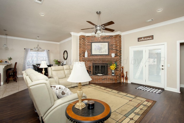 8103 El Paso Dr, Amarillo, TX 79118 - living area with ceiling fan, wood finished floors, crown molding, a brick fireplace, and baseboards