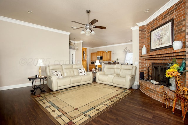 8103 El Paso Dr, Amarillo, TX 79118 - living room featuring wood finished floors, a ceiling fan, a fireplace, ornamental molding, and baseboards
