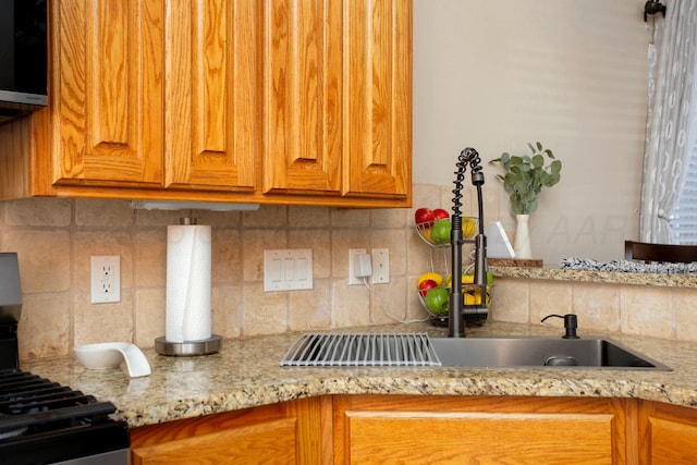 8103 El Paso Dr, Amarillo, TX 79118 - kitchen with tasteful backsplash, brown cabinetry, and light stone counters