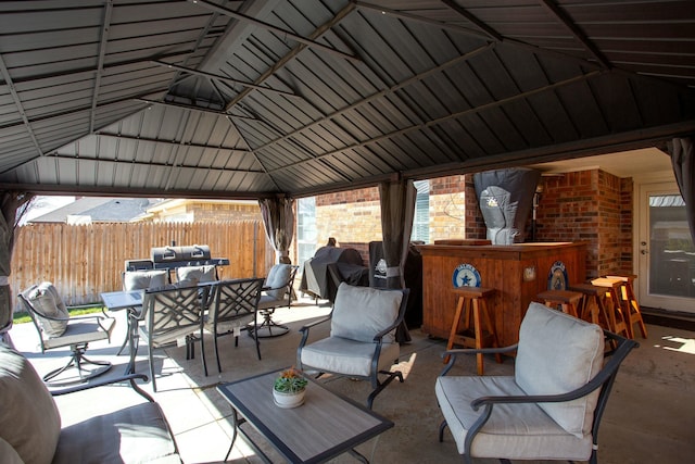 8103 El Paso Dr, Amarillo, TX 79118 - view of patio featuring fence, outdoor dining area, and a gazebo