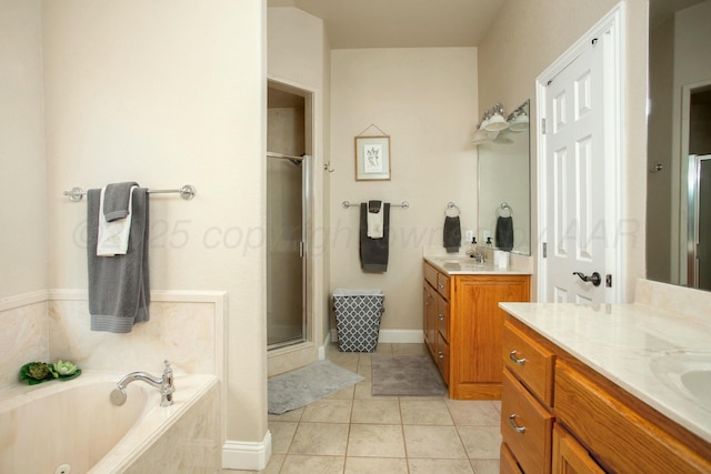 8103 El Paso Dr, Amarillo, TX 79118 - full bathroom featuring a shower stall, tile patterned floors, a garden tub, and two vanities