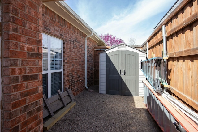 8103 El Paso Dr, Amarillo, TX 79118 - view of patio featuring a storage shed and an outbuilding