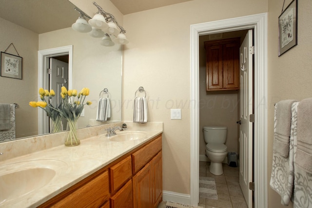 8103 El Paso Dr, Amarillo, TX 79118 - bathroom with tile patterned flooring, double vanity, toilet, and baseboards