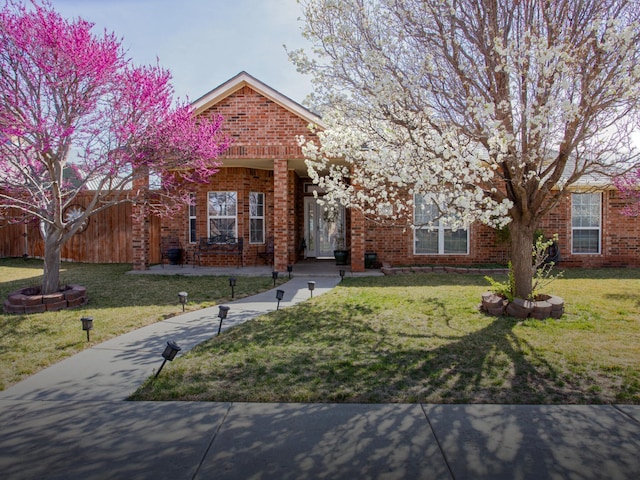 8103 El Paso Dr, Amarillo, TX 79118 - view of front facade with brick siding and a front lawn