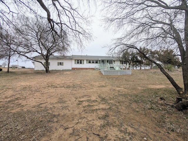 rear view of house with a deck