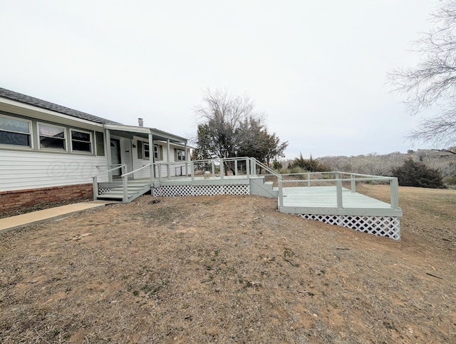 view of yard featuring a wooden deck