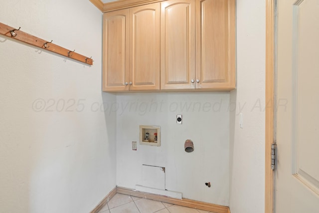 1321 Buena Vista St, Amarillo, TX 79106 - washroom featuring cabinet space, electric dryer hookup, hookup for a washing machine, and light tile patterned floors
