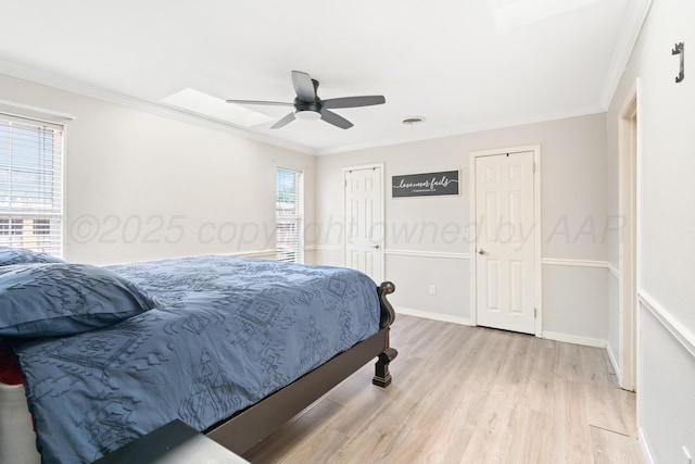 1321 Buena Vista St, Amarillo, TX 79106 - bedroom with light wood-type flooring, crown molding, and ceiling fan