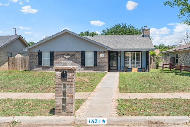 1321 Buena Vista St, Amarillo, TX 79106 - view of front of property featuring brick siding and a chimney