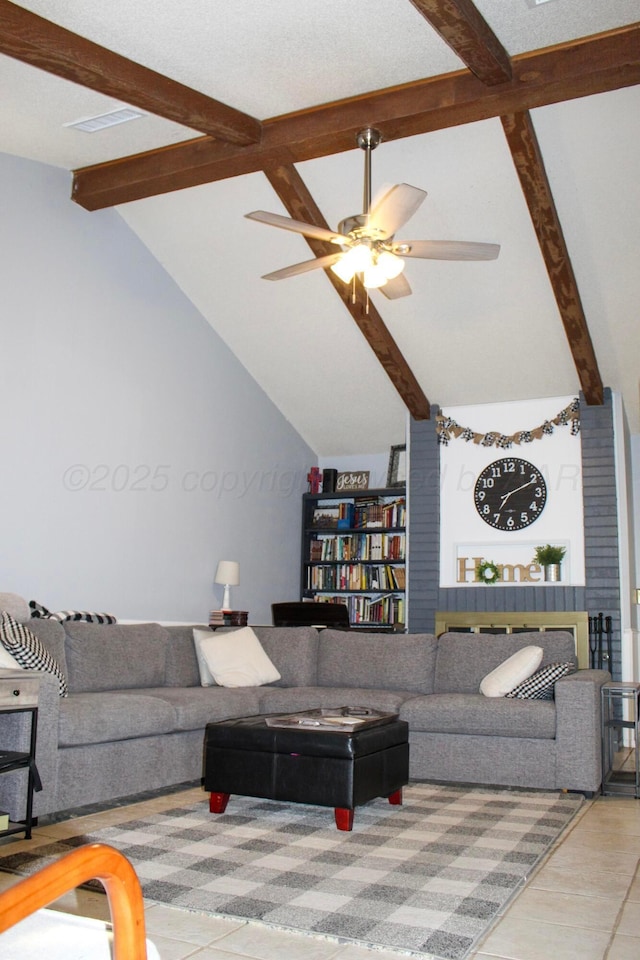 living room with ceiling fan and vaulted ceiling with beams