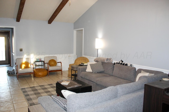 living area with beam ceiling, tile patterned floors, and high vaulted ceiling