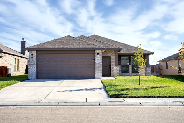 view of front of house with a front lawn and a garage