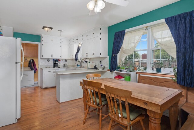 3515 Linda Dr, Amarillo, TX 79109 - dining area featuring light wood finished floors, ceiling fan, and washer / dryer