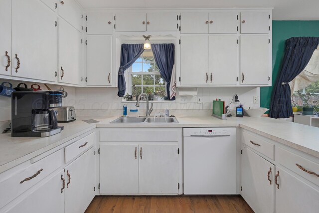 3515 Linda Dr, Amarillo, TX 79109 - kitchen featuring white dishwasher, light countertops, and white cabinets