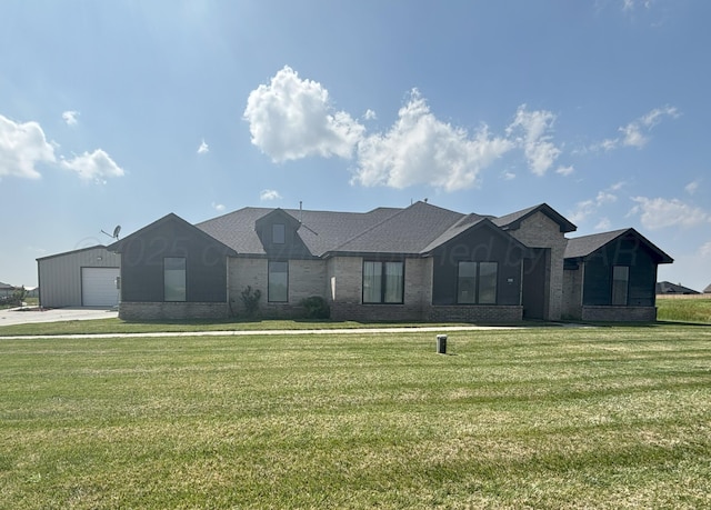 single story home with brick siding and a front lawn