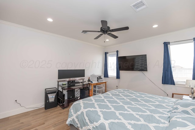 bedroom with recessed lighting, visible vents, and wood finished floors