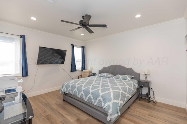 bedroom with crown molding, recessed lighting, wood finished floors, and baseboards