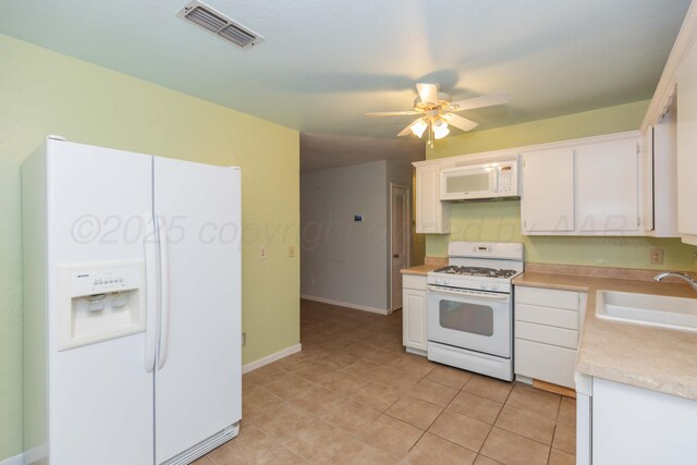 3604 SE 30th Ave, Amarillo, TX 79103 - kitchen with white appliances, a sink, light countertops, a ceiling fan, and white cabinetry