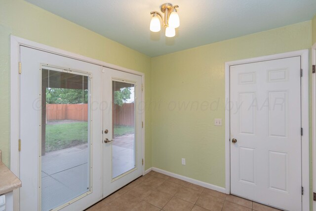 3604 SE 30th Ave, Amarillo, TX 79103 - entryway featuring french doors, light tile patterned floors, and baseboards
