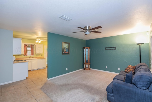 3604 SE 30th Ave, Amarillo, TX 79103 - living room with ceiling fan, baseboards, and light tile patterned flooring