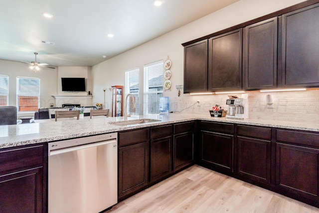 1800 Morningside Ave, Amarillo, TX 79118 - kitchen with dishwasher, light stone countertops, ceiling fan, light wood-style flooring, and tasteful backsplash