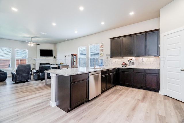 1800 Morningside Ave, Amarillo, TX 79118 - kitchen featuring stainless steel dishwasher, a peninsula, plenty of natural light, light wood finished floors, and recessed lighting