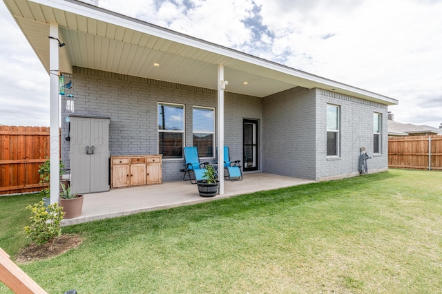 1800 Morningside Ave, Amarillo, TX 79118 - back of property with brick siding, a patio area, and a fenced backyard