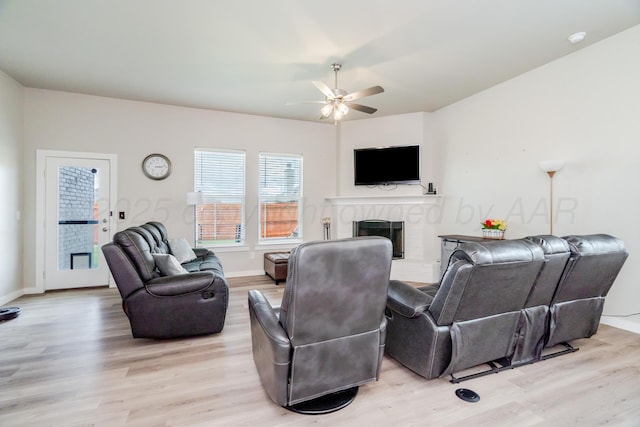 1800 Morningside Ave, Amarillo, TX 79118 - living area featuring a ceiling fan, light wood-style flooring, and a brick fireplace