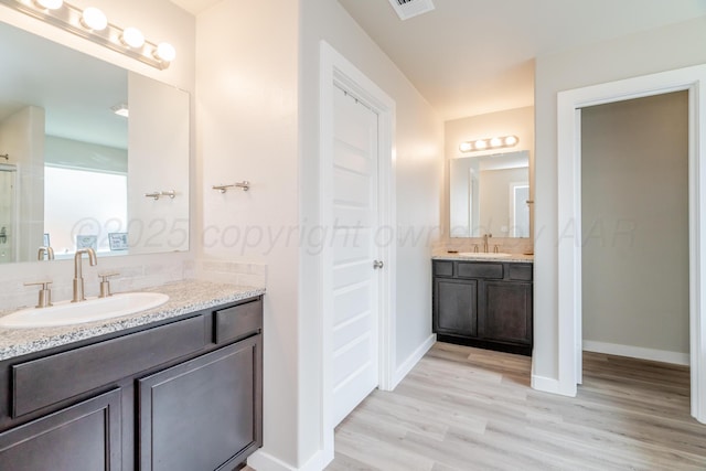 1800 Morningside Ave, Amarillo, TX 79118 - full bathroom with wood finished floors and vanity