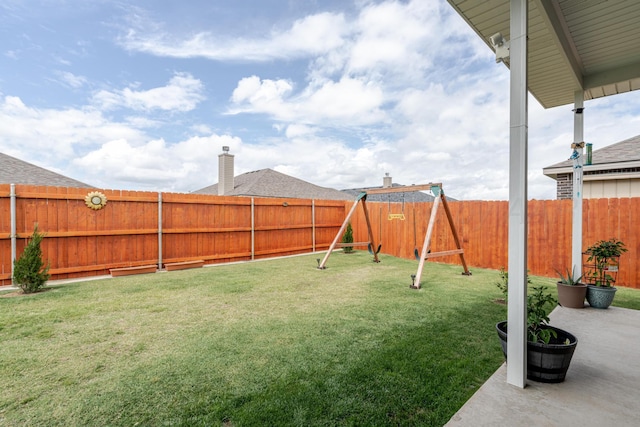 1800 Morningside Ave, Amarillo, TX 79118 - fenced backyard featuring a playground and a patio area