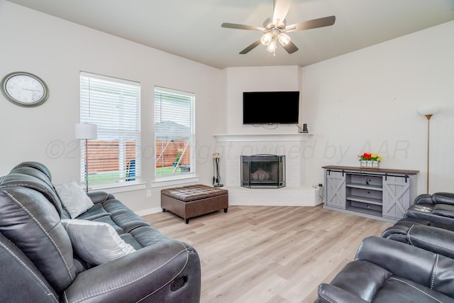 1800 Morningside Ave, Amarillo, TX 79118 - living room with wood finished floors, ceiling fan, and a fireplace