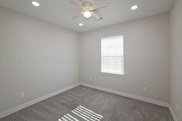 carpeted empty room featuring ceiling fan