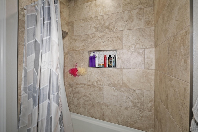 bathroom with shower / tub combo with curtain