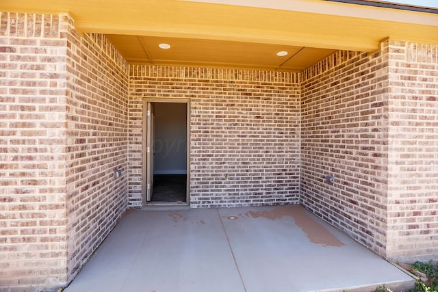 doorway to property with a patio