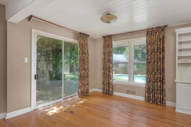 1805 S Julian Blvd, Amarillo, TX 79102 - empty room with wood-type flooring and baseboards