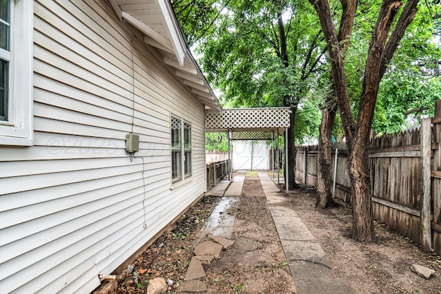 3704 Fountain Ter, Amarillo, TX 79106 - view of side of home with a fenced backyard
