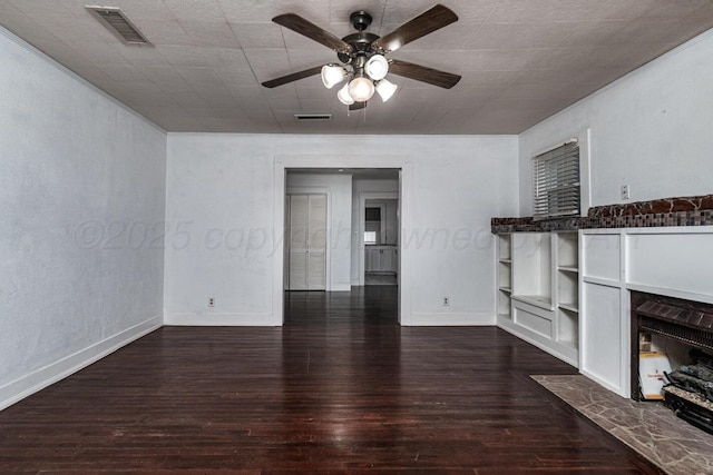 3704 Fountain Ter, Amarillo, TX 79106 - unfurnished living room featuring ceiling fan, baseboards, hardwood / wood-style floors, built in features, and a fireplace with flush hearth