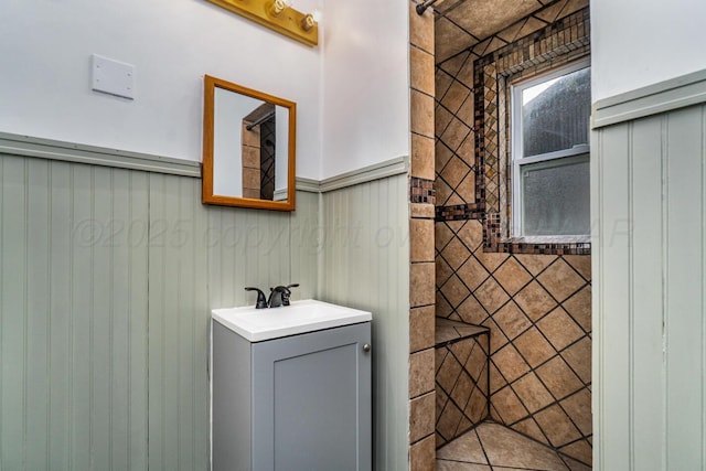 3704 Fountain Ter, Amarillo, TX 79106 - bathroom featuring vanity and a wainscoted wall