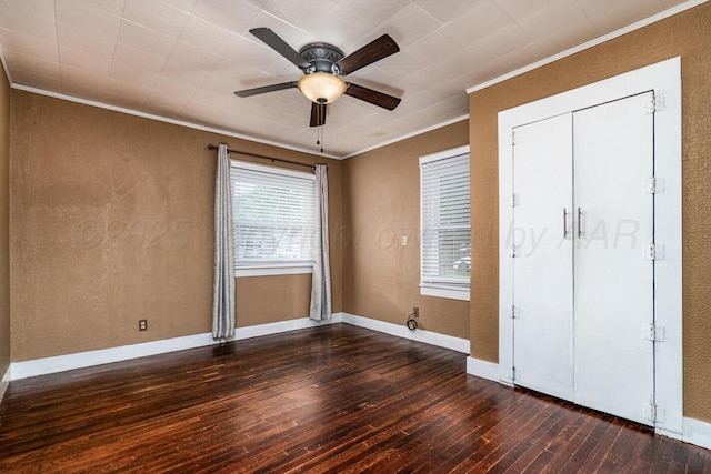 3704 Fountain Ter, Amarillo, TX 79106 - unfurnished bedroom with ornamental molding, dark wood-type flooring, multiple windows, a ceiling fan, and a textured wall