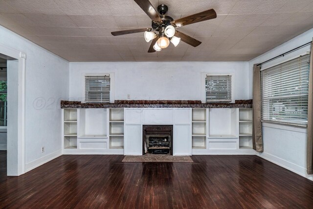 3704 Fountain Ter, Amarillo, TX 79106 - unfurnished living room with dark wood-style floors, baseboards, and a ceiling fan