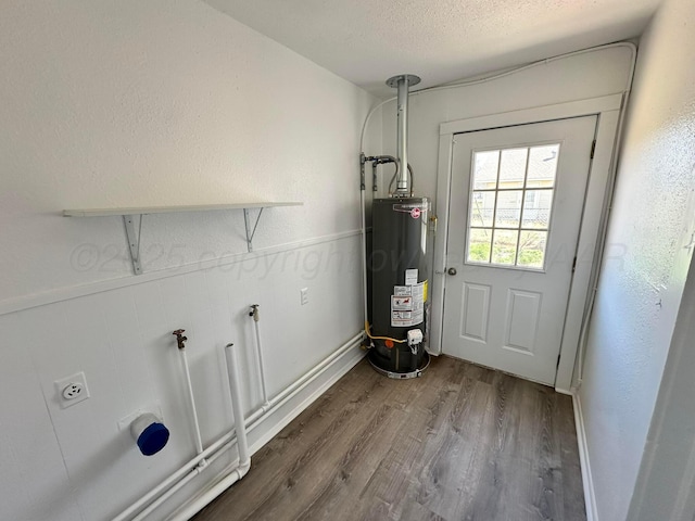 1106 Coke St, Vega, TX 79092 - utility room with water heater