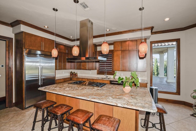 13 Prestwick Ln, Amarillo, TX 79124 - kitchen featuring built in refrigerator, island exhaust hood, gas cooktop, light tile patterned floors, and crown molding