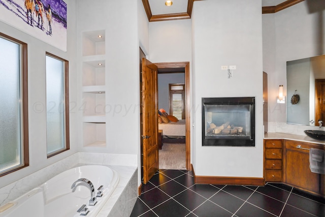 13 Prestwick Ln, Amarillo, TX 79124 - ensuite bathroom with a high ceiling, vanity, a bath, tile patterned flooring, and built in shelves
