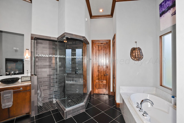 bathroom featuring tile patterned floors, vanity, and independent shower and bath
