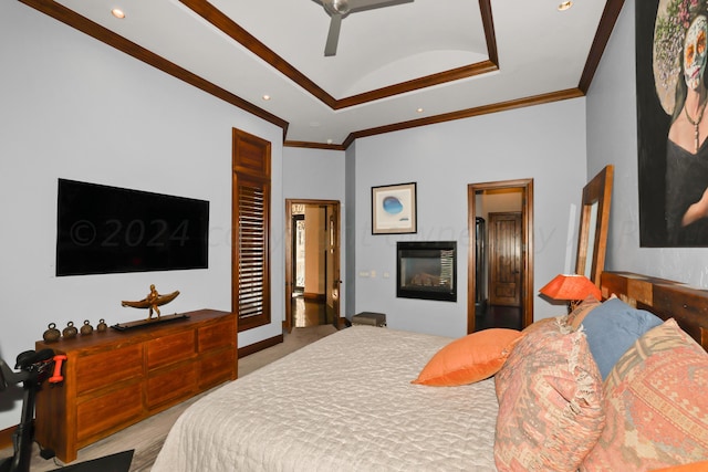 carpeted bedroom featuring ceiling fan and crown molding