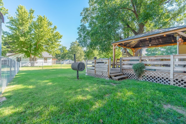 view of yard featuring a wooden deck and a gazebo