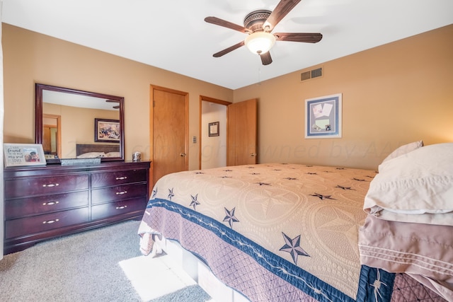 bedroom with ceiling fan and carpet