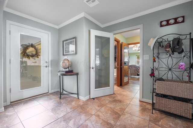 doorway with crown molding and light tile patterned floors