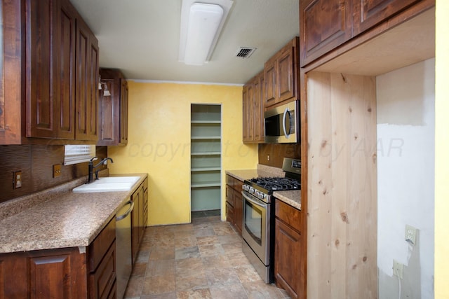 kitchen featuring stainless steel appliances and sink