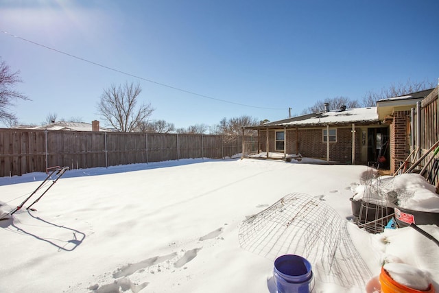 view of yard layered in snow